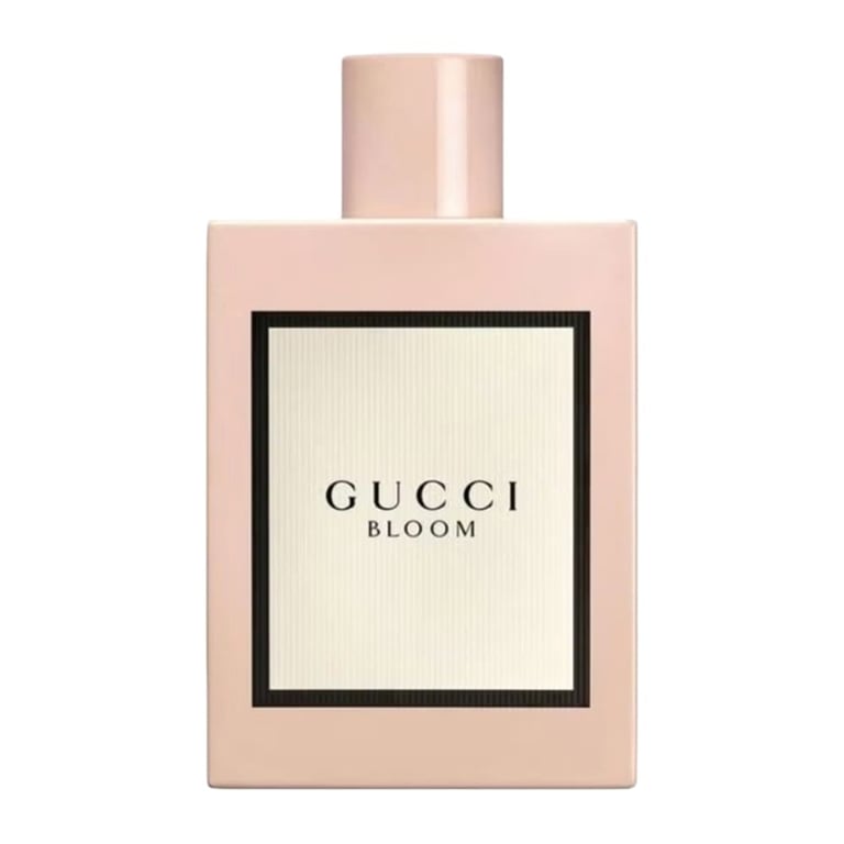 Gucci Bloom perfume bottle with beige label and rose gold cap on white background