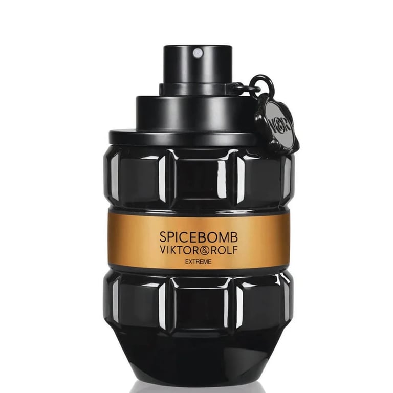 Black cylindrical fragrance bottle with gold label reading Spicebomb Viktor & Rolf Extreme and decorative studs