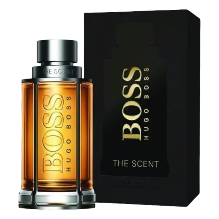 Hugo Boss The Scent cologne bottle with golden amber liquid next to black packaging box