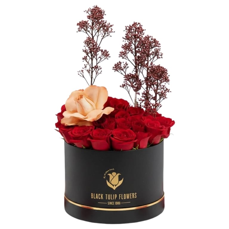 Black Tulip Flowers luxury arrangement with red and peach roses and dried burgundy floral stems in a black cylindrical box with gold accents