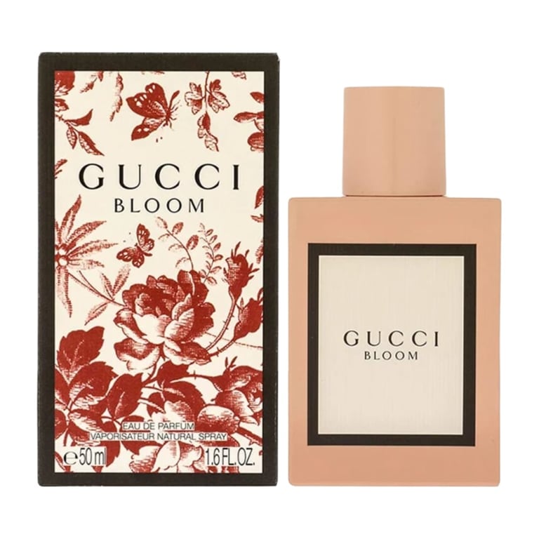 Gucci Bloom perfume bottle and box with red floral pattern design