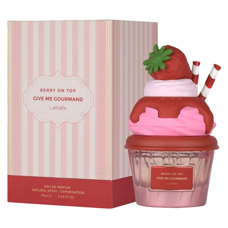 Cupcake-shaped eau de parfum bottle in pink and red with strawberry on top, next to pink striped box