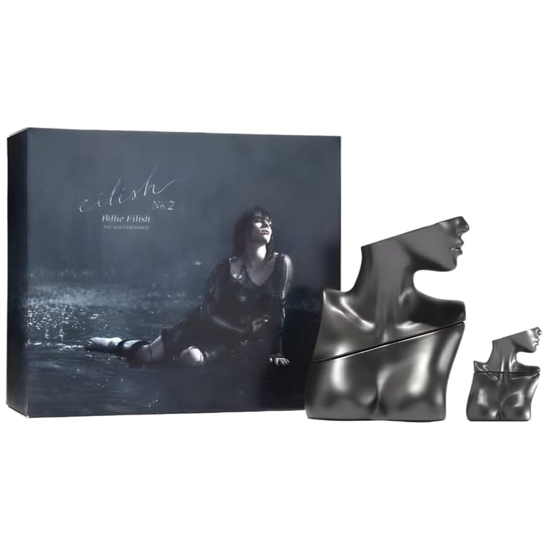 Fragrance set featuring album cover and two metallic sculptural female head vessels in different sizes